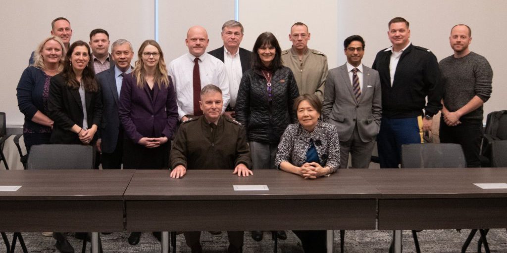 U.S. Cyber Command Deputy Commander Lieutenant General William J. Hartman (front left) is shown with DARPA director Stefanie Tompkins (front right) and members of Cyber Command and DARPA after signing the Constellation agreement in May 2024 (U.S. Cyber Command).