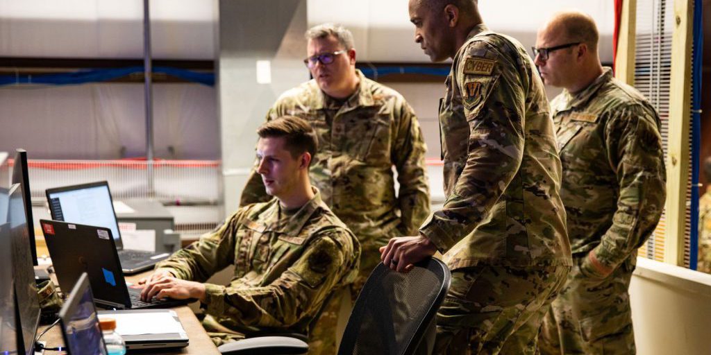 USAF personnel looking at a computer screen